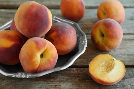 canva fresh peaches on a wooden background MAD Q Gw554