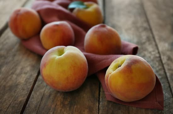 canva fresh peaches on a wooden background MAD Q1fHoYE