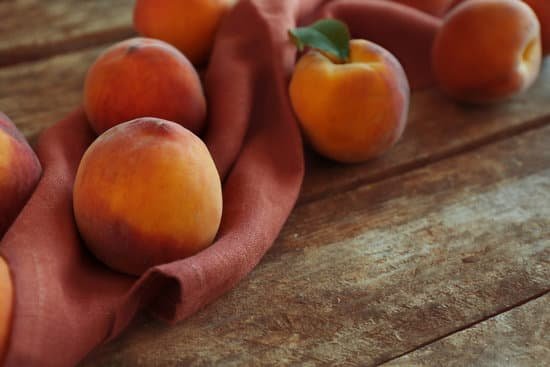canva fresh peaches on a wooden background MAD Q6w98Uw