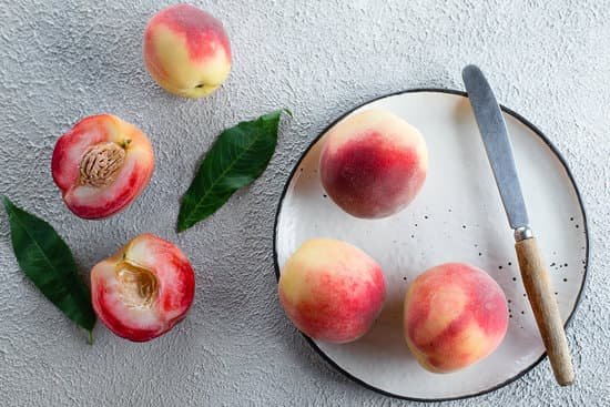 canva fresh peaches on concrete background MAEEfE6limU