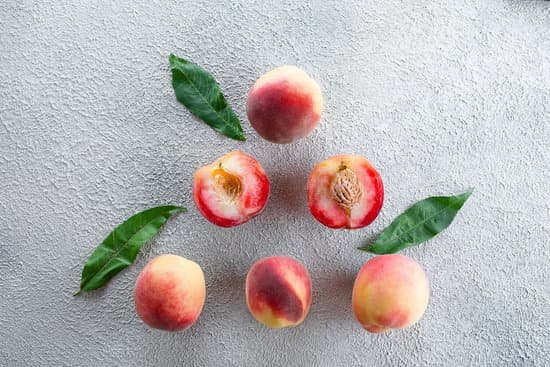 canva fresh peaches on concrete background MAEEfOTofpo