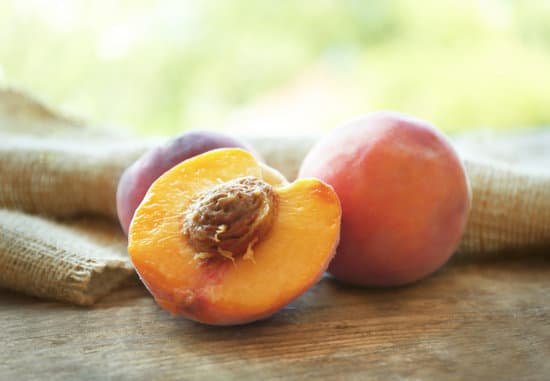canva fresh peaches on wooden table MAD QyS1AwU
