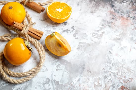 canva fresh persimmons with cinnamon on light background MAEQbtcYAe4