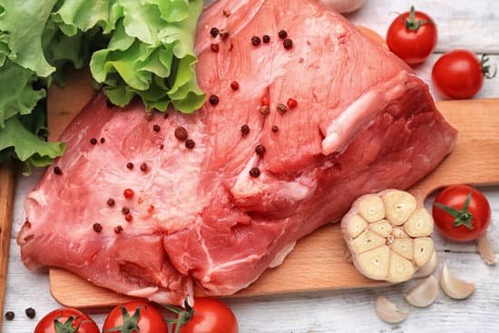 canva fresh raw meat on wooden board MAD9T1GacNo