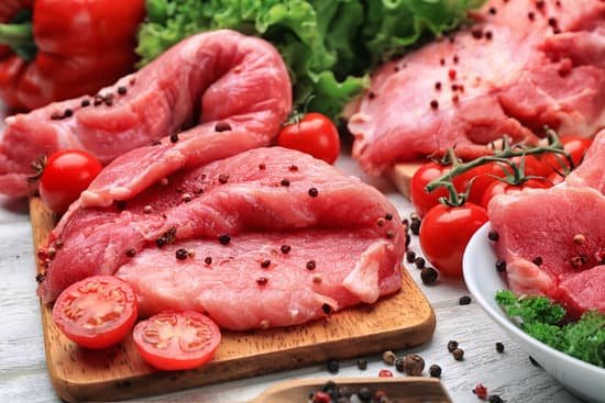 canva fresh raw meat on wooden board MAD9TjN3P00