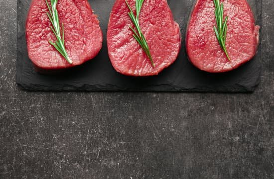 canva fresh raw meat with rosemary on a slate plate MAD9T5zP5OA