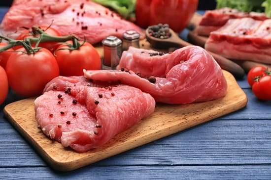 canva fresh raw meat with spices on wooden board MAD9T3T5ncI