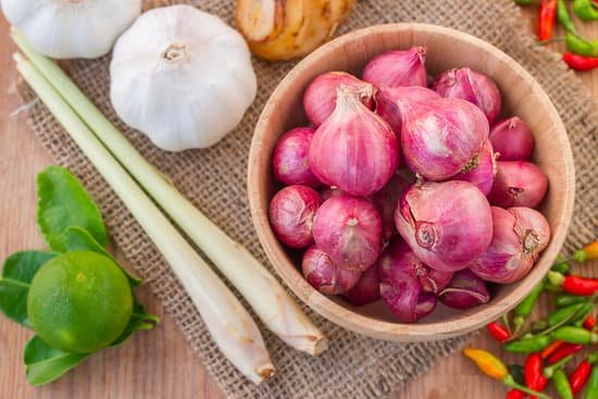 canva fresh shallot red shallot in wooden bowl MADBv1pJGbI