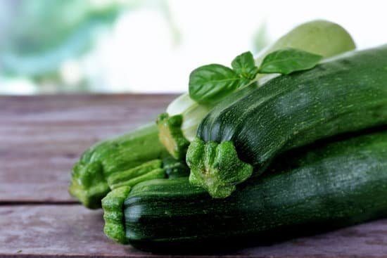 canva fresh zucchinis with basil leaves MAD MbsR6EI