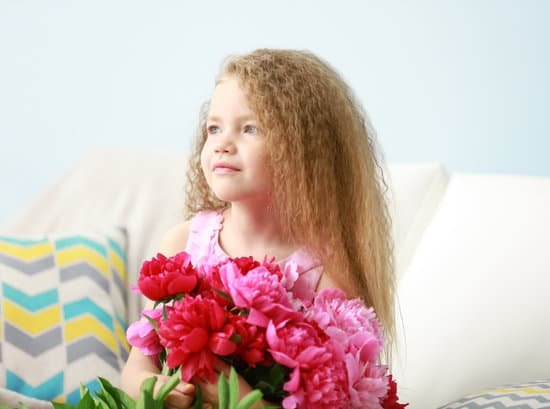 canva girl holding peonies bouquet indoors MAD Q2gOolU