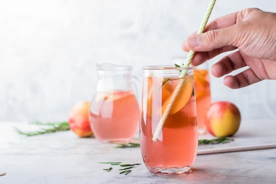 canva glasses of peach and rosemary lemonade on a table MAD Z97mwzc