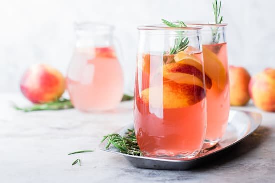 canva glasses of rosemary peach lemonade on a table MAD Zzkrvg4