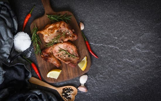 canva grilled pork meat with herbs and spices on concrete surface MAELwhyFZhg