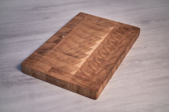 canva handmade oak cutting board on a wooden grey background MAD78uOyTBk
