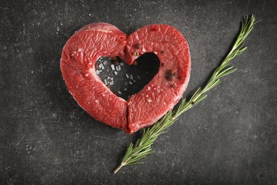 canva heart made of fresh raw meat on table MAD9TzK36Lc