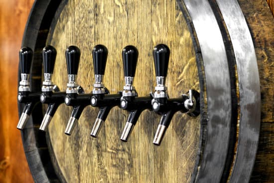 canva large oak wine barrel with a row of spigots MAEOn4w3NGg