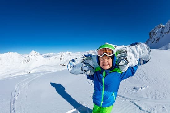 canva little boy holding snowboard MAD ghHjENM