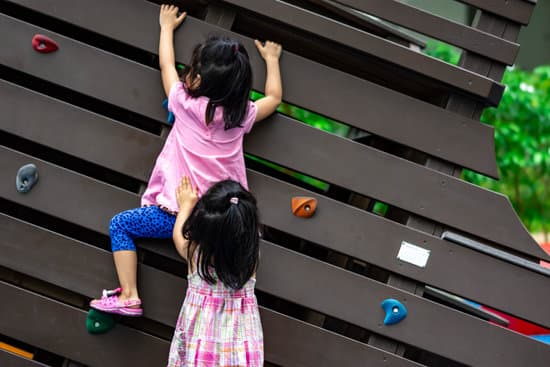 canva little girls climbing in the playground MAER4ZqGLcQ