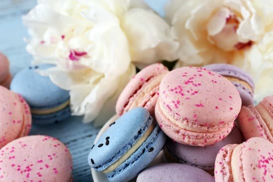 canva macaroons with peonies on wooden background MAD