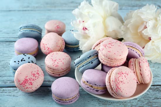 canva macaroons with peonies on wooden table MAD Q9X7 6E