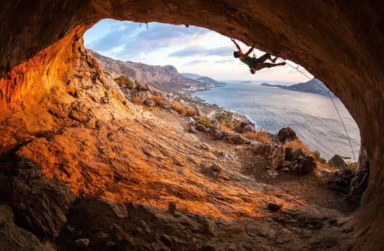 canva male rock climber climbing along a roof in a cave MADaAQ p Fk