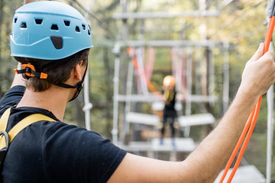 canva man climbing in a rope park