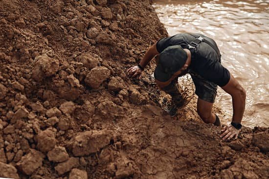 canva man climbing in mud MADE0olchuc