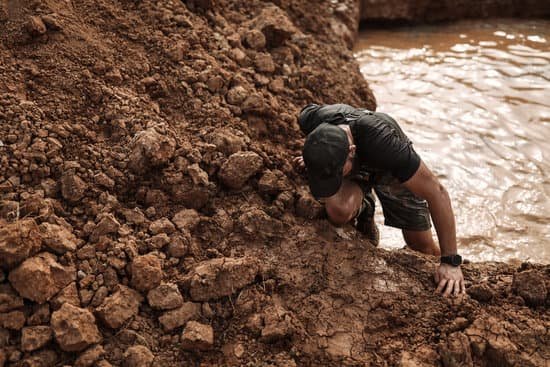 canva man climbing on mud MADE0mB9zQ4