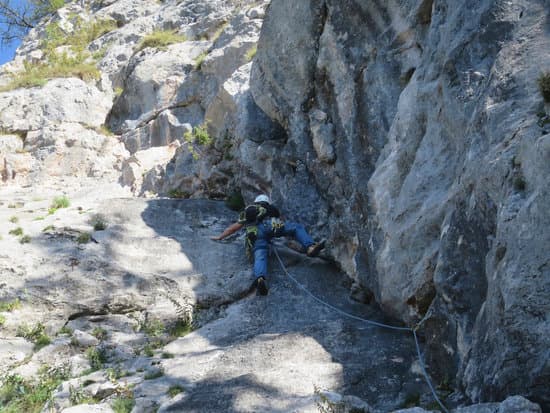 canva man doing rock climbing