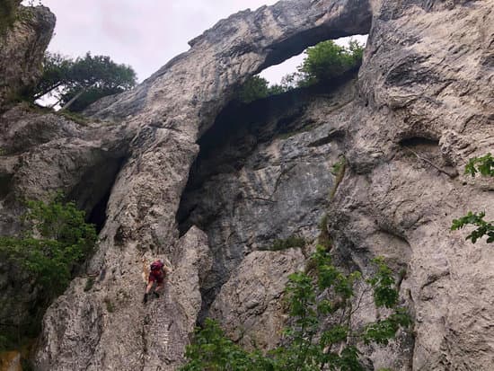 canva man rock climbing in rocky mountain MAEEY5cAW7Q