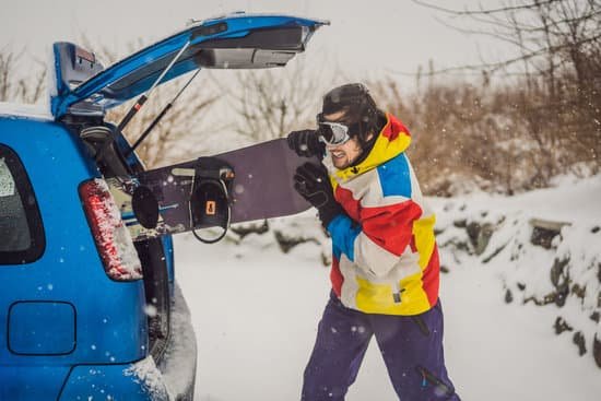 canva man trying to fit a snowboard into car MAELG0pr3GY