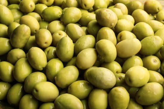 canva many green olives as background MAD9T9cn a0