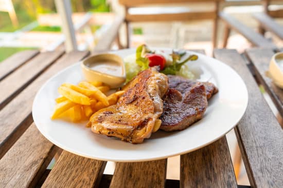 canva meat plate of steaks and fries. MAEO1m1ywjk