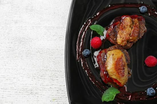 canva meat with sauce on black plate MAD Q2cln8k