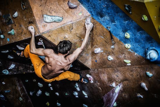 canva muscular man practicing rock climbing