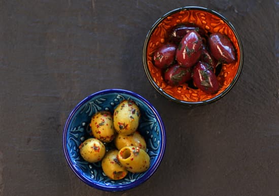canva olives in bowls on the table MAEOVJyKLLA