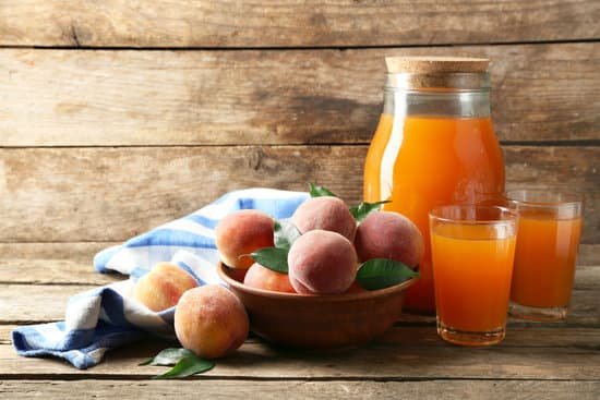 canva peaches with glasses of juice MAD MtAyjQc