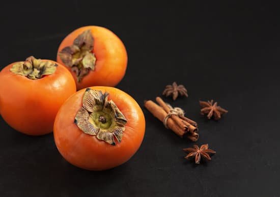canva persimmon with spices on black background MAEK8o1C078