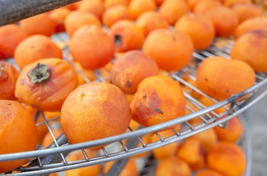 canva persimmons drying under the sun