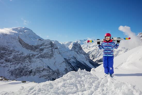 canva person holding a snowboard on a snow mountain MAD gvEHp2s