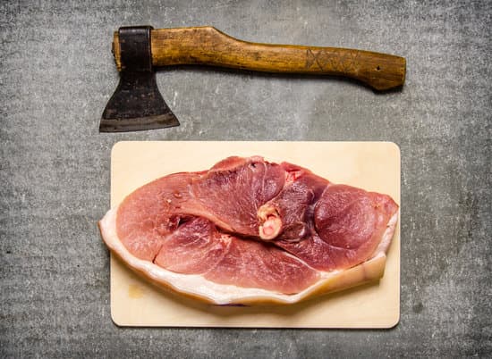 canva piece of raw pork with a hatchet for meat cutting MAESm 6hR E