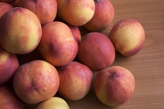 canva pile of peaches on wooden table MAEB g8d0Jc
