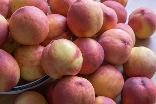 canva pile of peaches on wooden table MAEB mJCXPU