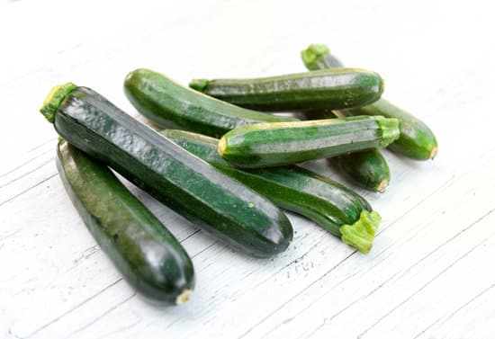 canva pile of zucchini on the table MAEOZy22J70