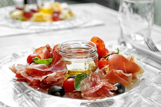 canva plate with tasty meat snacks on table MAD