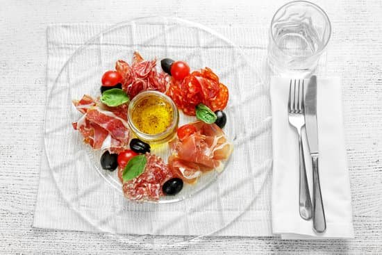 canva plate with tasty meat snacks on wooden table MAD Q tDGDs