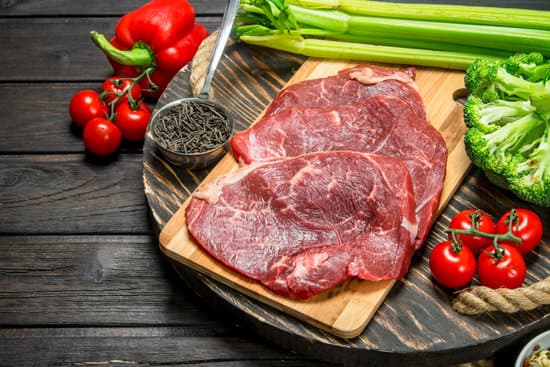 canva raw beef meat with organic food assortment MAEPwNtWDjI