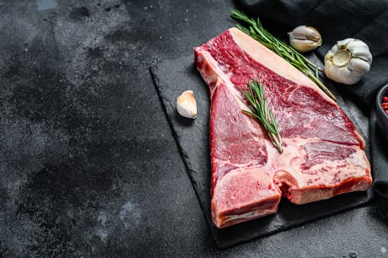 canva raw fresh meat t bone steak with spices garlic and rosemary MAEQ7w4rNRk