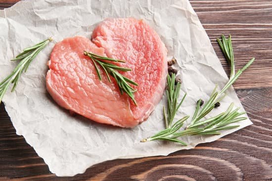 canva raw meat shaped like a heart with rosemary leaves MAD9Tws bUM