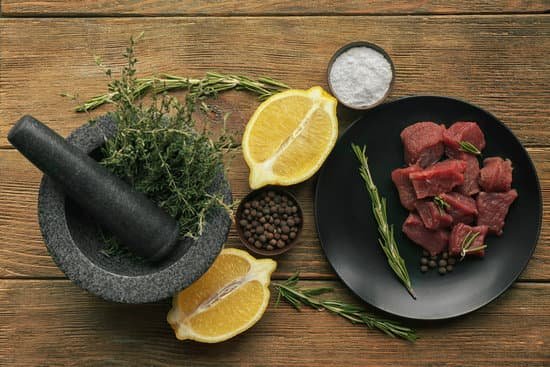 canva raw meat with spices and vegetables on table MAD Q7PdYZ4